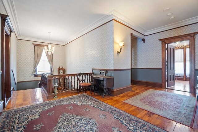 4 W Broadway, Gardner, MA 01440 - interior space featuring ornamental molding, wood-type flooring, an upstairs landing, and a chandelier