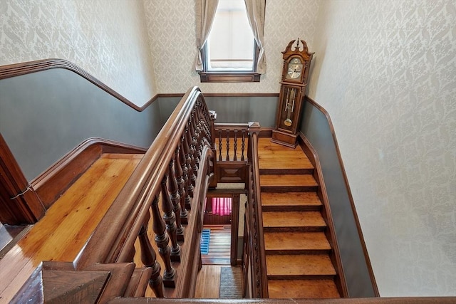 4 W Broadway, Gardner, MA 01440 - staircase featuring baseboards, wainscoting, and wallpapered walls