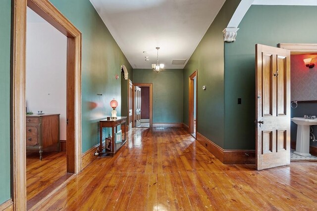 4 W Broadway, Gardner, MA 01440 - hall featuring baseboards, hardwood / wood-style floors, a sink, and visible vents