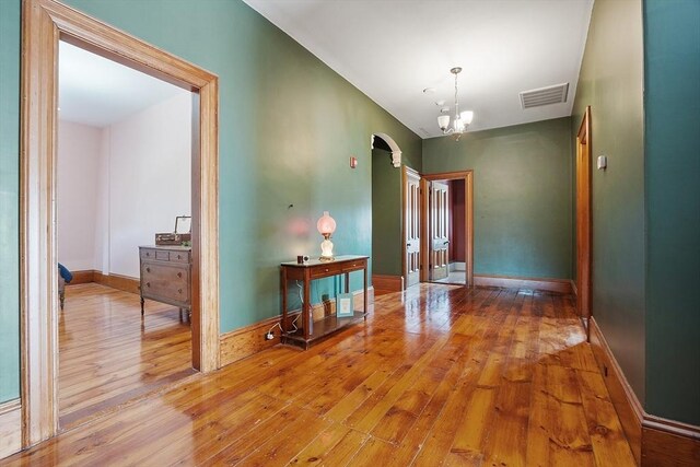 4 W Broadway, Gardner, MA 01440 - corridor with arched walkways, visible vents, hardwood / wood-style flooring, and baseboards