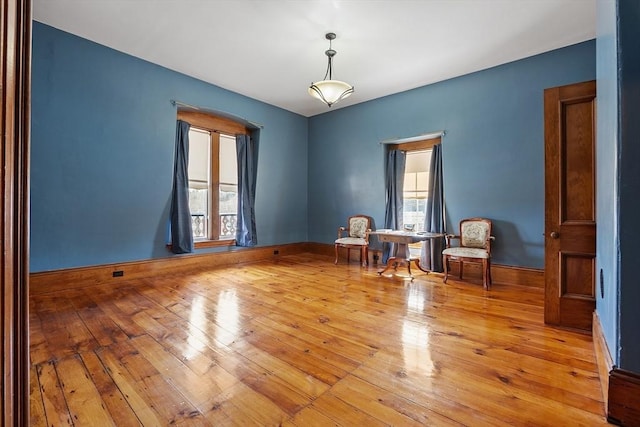 4 W Broadway, Gardner, MA 01440 - empty room featuring light wood-type flooring, baseboards, and a wealth of natural light