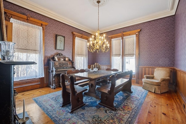 4 W Broadway, Gardner, MA 01440 - dining space featuring light wood-style flooring, wallpapered walls, an inviting chandelier, and wainscoting