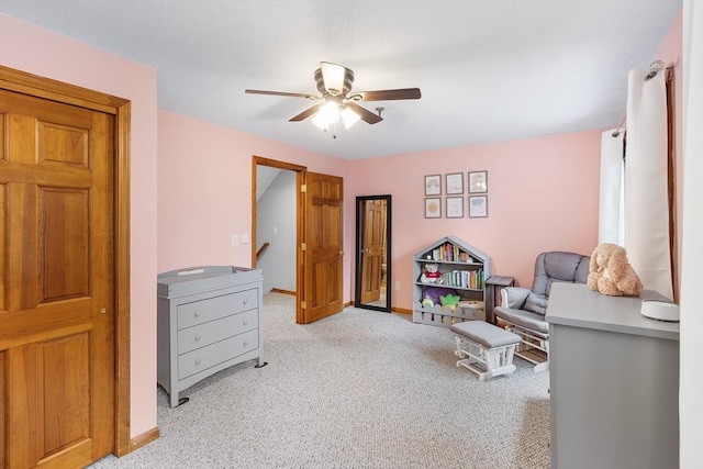 36 Tobey Rd Unit 25, Dracut, MA 01826 - living area with a ceiling fan, light colored carpet, and baseboards