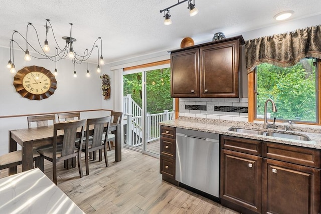 36 Tobey Rd Unit 25, Dracut, MA 01826 - kitchen featuring dishwasher, a sink, dark brown cabinetry, backsplash, and light wood finished floors