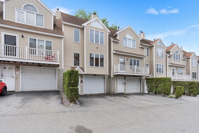 36 Tobey Rd Unit 25, Dracut, MA 01826 - townhome / multi-family property with a garage, driveway, and a residential view