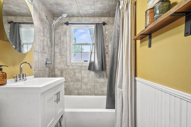 114 Linebrook Rd, Ipswich, MA 01938 - bathroom with shower / bath combo with shower curtain, vanity, and wainscoting
