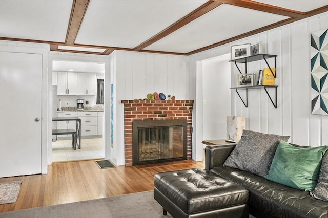 114 Linebrook Rd, Ipswich, MA 01938 - living area featuring light wood-style floors and a brick fireplace