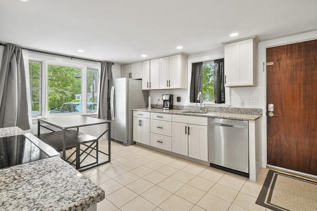 114 Linebrook Rd, Ipswich, MA 01938 - kitchen featuring appliances with stainless steel finishes, a sink, white cabinets, healthy amount of natural light, and recessed lighting
