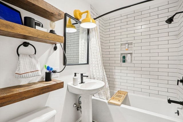 bathroom featuring toilet and shower / bathtub combination with curtain