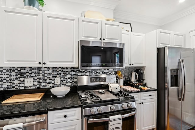 kitchen featuring crown molding, white cabinets, tasteful backsplash, and stainless steel appliances