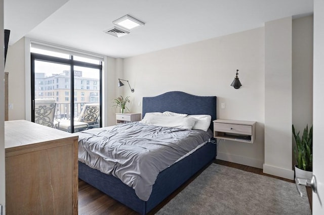 121 Portland St Unit 902, Boston, MA 02114 - bedroom featuring baseboards and dark wood-type flooring