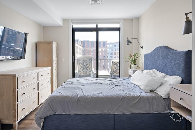 121 Portland St Unit 902, Boston, MA 02114 - bedroom featuring dark wood finished floors and access to exterior
