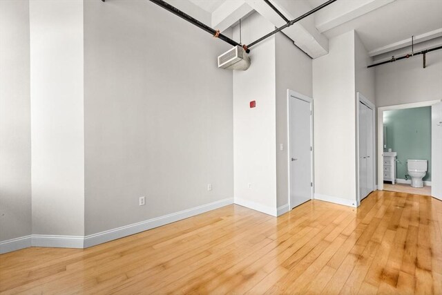51 Lafayette St Unit 304, Salem, MA 01970 - empty room with wood finished floors and baseboards