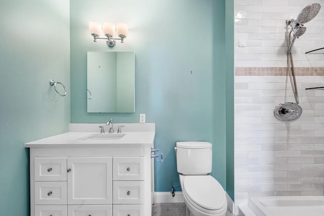 51 Lafayette St Unit 304, Salem, MA 01970 - bathroom featuring a tile shower, toilet, and vanity