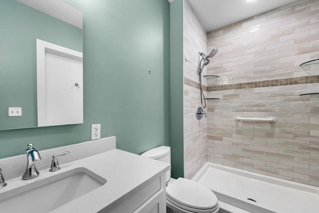 51 Lafayette St Unit 304, Salem, MA 01970 - bathroom featuring toilet, tiled shower, and vanity