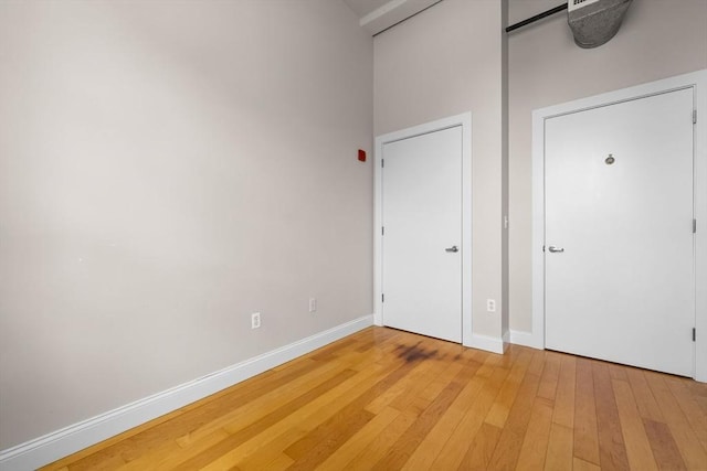 51 Lafayette St Unit 304, Salem, MA 01970 - unfurnished bedroom with light wood-style floors and baseboards