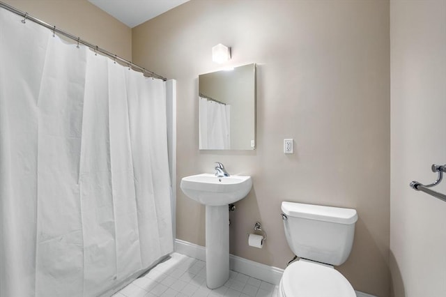 51 Lafayette St Unit 304, Salem, MA 01970 - bathroom with toilet, tile patterned flooring, curtained shower, and a sink