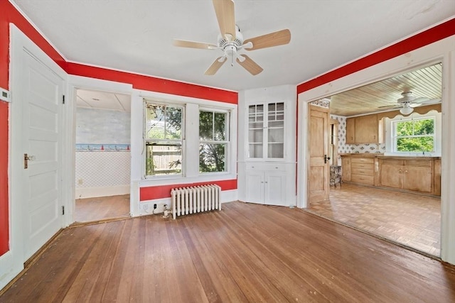 2 Eastern Ave, Hull, MA 02045 - empty room with radiator, a ceiling fan, and wood-type flooring