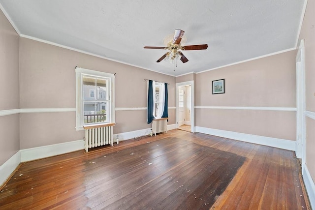 2 Eastern Ave, Hull, MA 02045 - empty room with radiator heating unit, ceiling fan, wood-type flooring, and ornamental molding