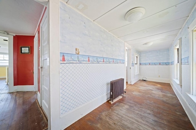 2 Eastern Ave, Hull, MA 02045 - hall with hardwood / wood-style flooring, radiator heating unit, and a wainscoted wall