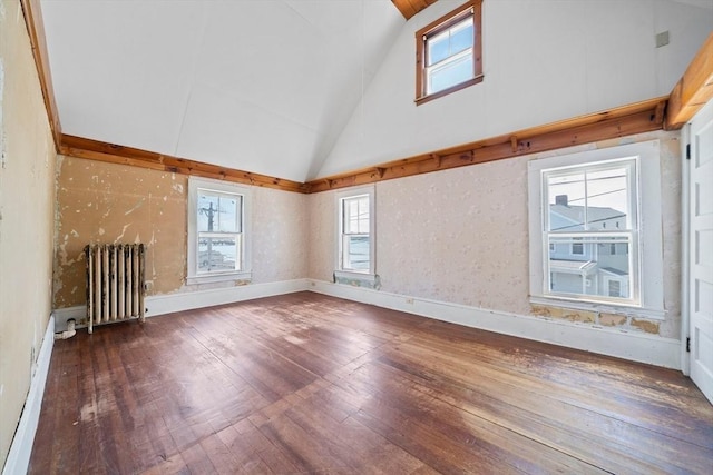 2 Eastern Ave, Hull, MA 02045 - unfurnished living room with radiator, high vaulted ceiling, and hardwood / wood-style flooring