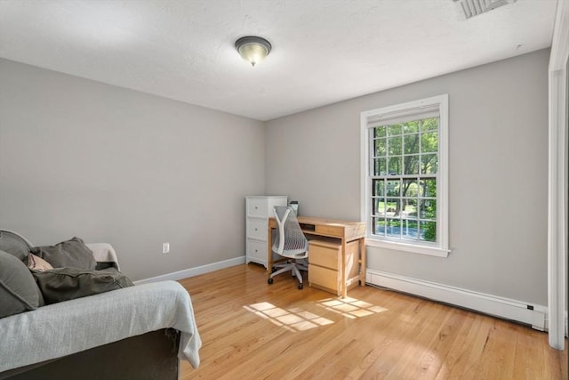 48 Pine Hill Dr, Walpole, MA 02081 - office area featuring a baseboard heating unit, baseboards, and light wood-style floors