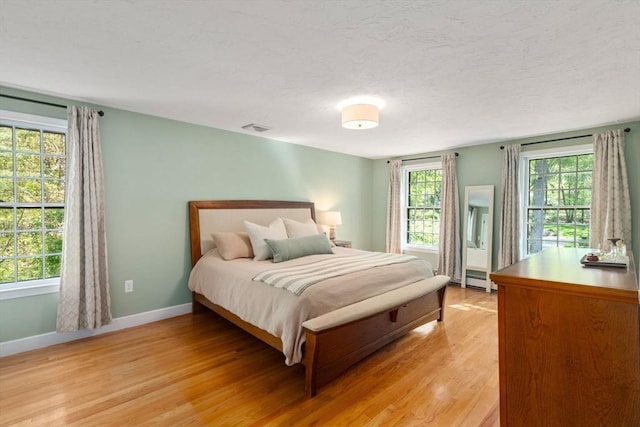 48 Pine Hill Dr, Walpole, MA 02081 - bedroom featuring light wood finished floors, baseboards, and multiple windows