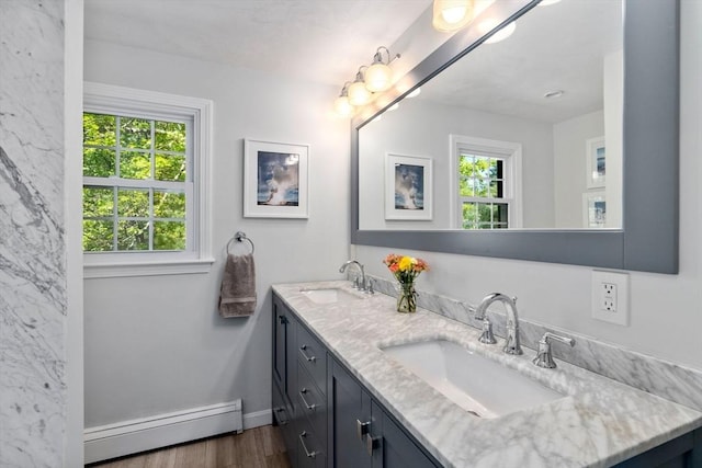 48 Pine Hill Dr, Walpole, MA 02081 - full bath featuring baseboard heating, healthy amount of natural light, wood finished floors, and double vanity