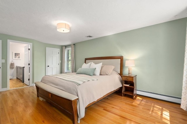 48 Pine Hill Dr, Walpole, MA 02081 - bedroom featuring a baseboard radiator, light wood finished floors, baseboards, and ensuite bathroom