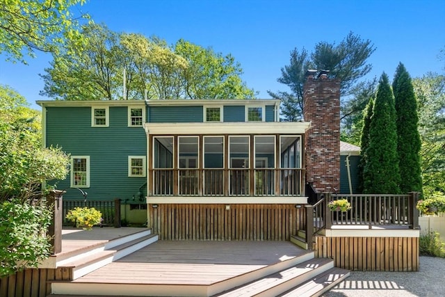 48 Pine Hill Dr, Walpole, MA 02081 - rear view of property featuring a sunroom, a chimney, and a wooden deck