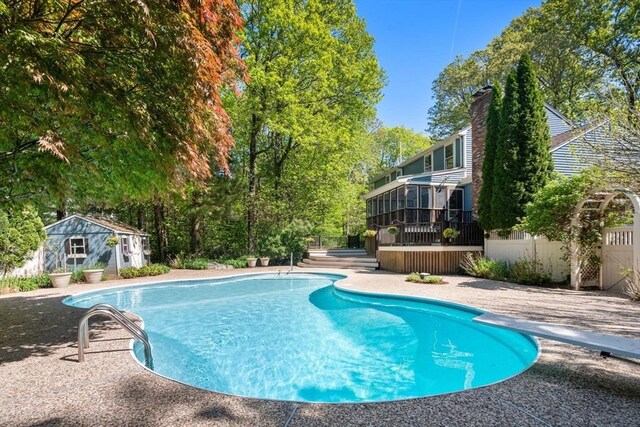 48 Pine Hill Dr, Walpole, MA 02081 - outdoor pool with a sunroom, a deck, an outbuilding, and fence