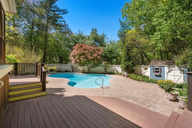48 Pine Hill Dr, Walpole, MA 02081 - view of pool featuring a wooden deck, a fenced backyard, a shed, and an outdoor structure