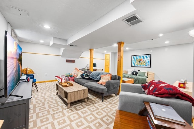 living area with recessed lighting and baseboards
