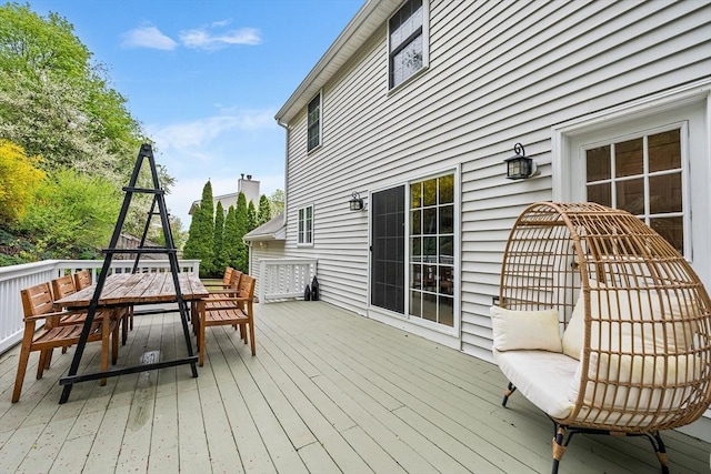 wooden deck with outdoor dining space