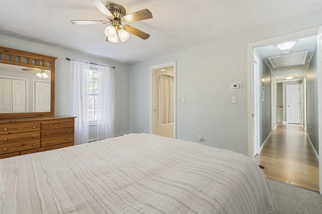 bedroom with ceiling fan and light colored carpet