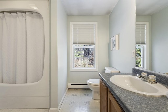 bathroom with a baseboard radiator, toilet, and vanity