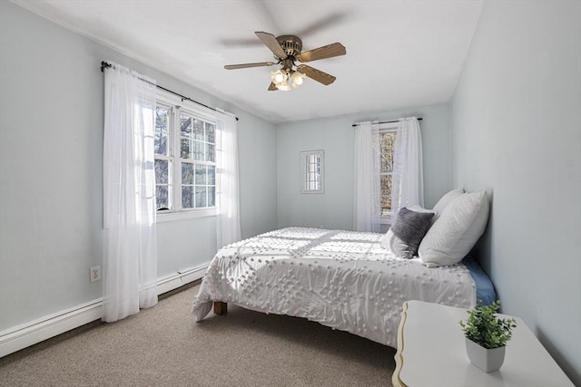 bedroom with ceiling fan, a baseboard heating unit, and carpet flooring