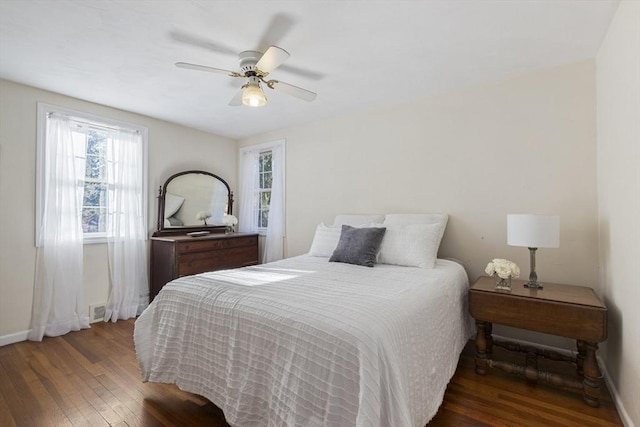 bedroom featuring ceiling fan and dark hardwood / wood-style flooring