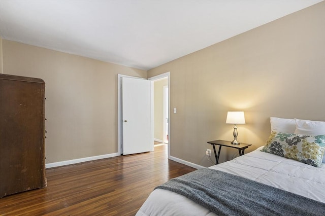 bedroom featuring dark wood-type flooring