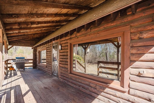 wooden deck featuring grilling area