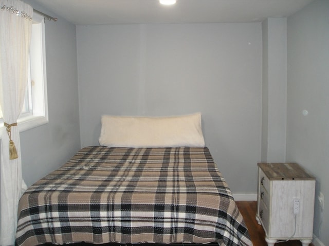 bedroom featuring dark wood-type flooring