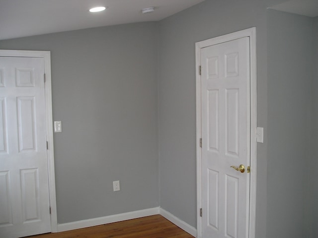 unfurnished room with dark hardwood / wood-style floors