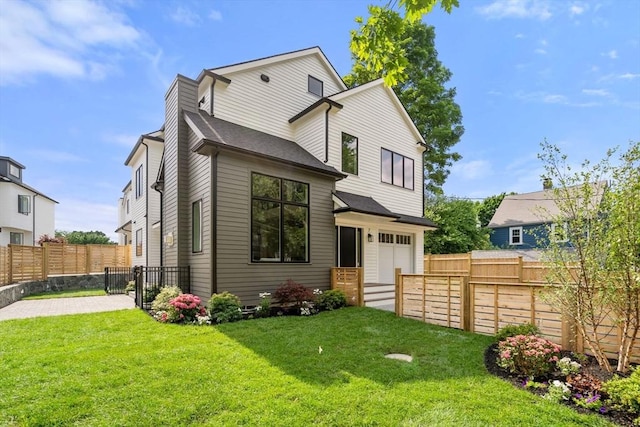 19 Johnson Pl Unit 19, Newton, MA 02466 - back of house featuring an attached garage, a shingled roof, and a gate