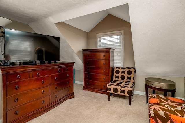 80 Andover, Peabody, MA 01960 - living area featuring light carpet, baseboards, and lofted ceiling