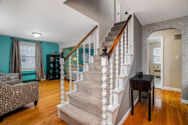 80 Andover, Peabody, MA 01960 - stairway with arched walkways, hardwood / wood-style flooring, baseboards, and radiator