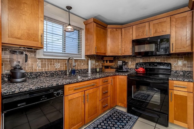80 Andover, Peabody, MA 01960 - kitchen featuring a sink, black appliances, light tile patterned flooring, and dark stone counters