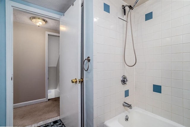 80 Andover, Peabody, MA 01960 - bathroom featuring a textured ceiling, baseboards, and washtub / shower combination