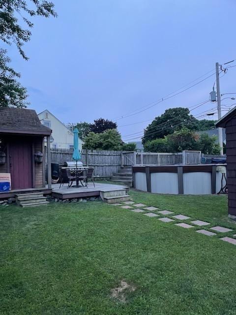 80 Andover, Peabody, MA 01960 - view of yard featuring a pool, fence, and a deck