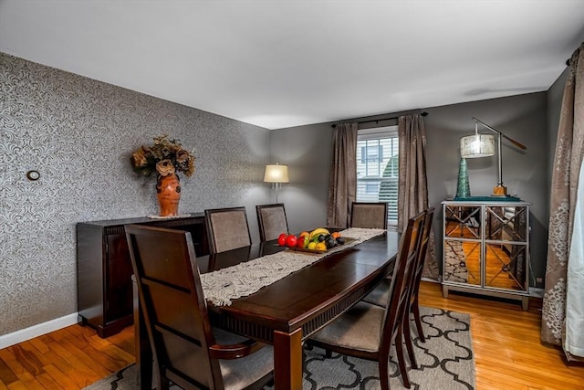 80 Andover, Peabody, MA 01960 - dining area featuring baseboards, wood finished floors, and wallpapered walls