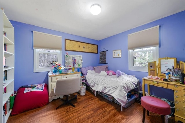 bedroom featuring wood finished floors